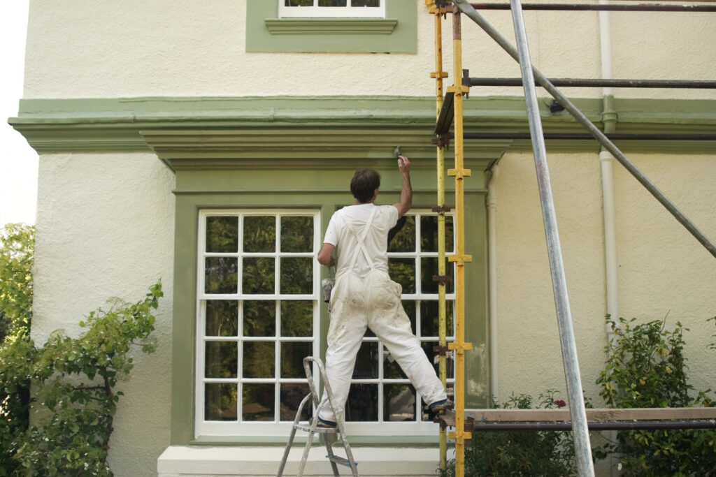 Zooby painter refreshing a San Antonio home exterior
