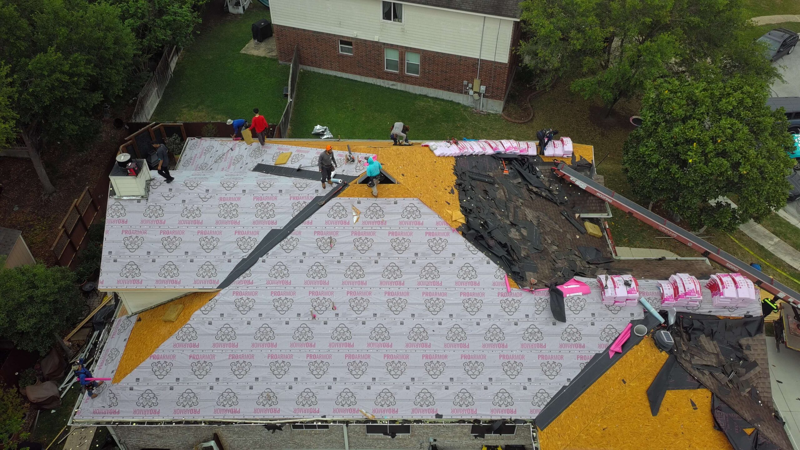 Zooby crew installing a new roof on a San Antonio home