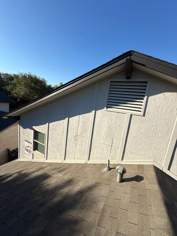 Close-up of weathered siding and trim on a San Antonio home exterior