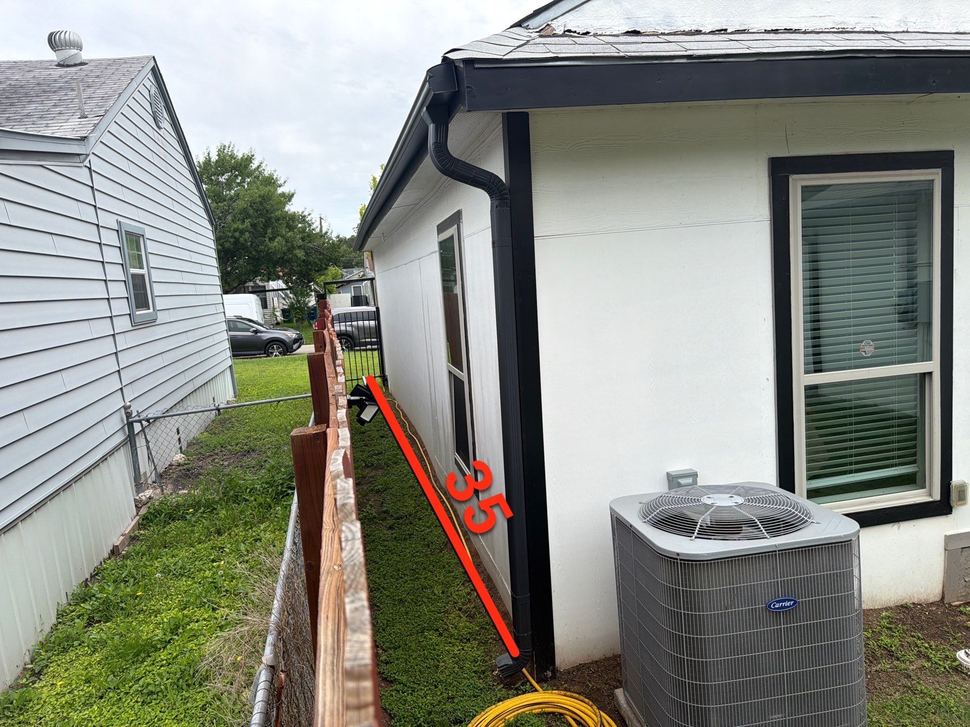 Before siding replacement — worn-out siding on a San Antonio home