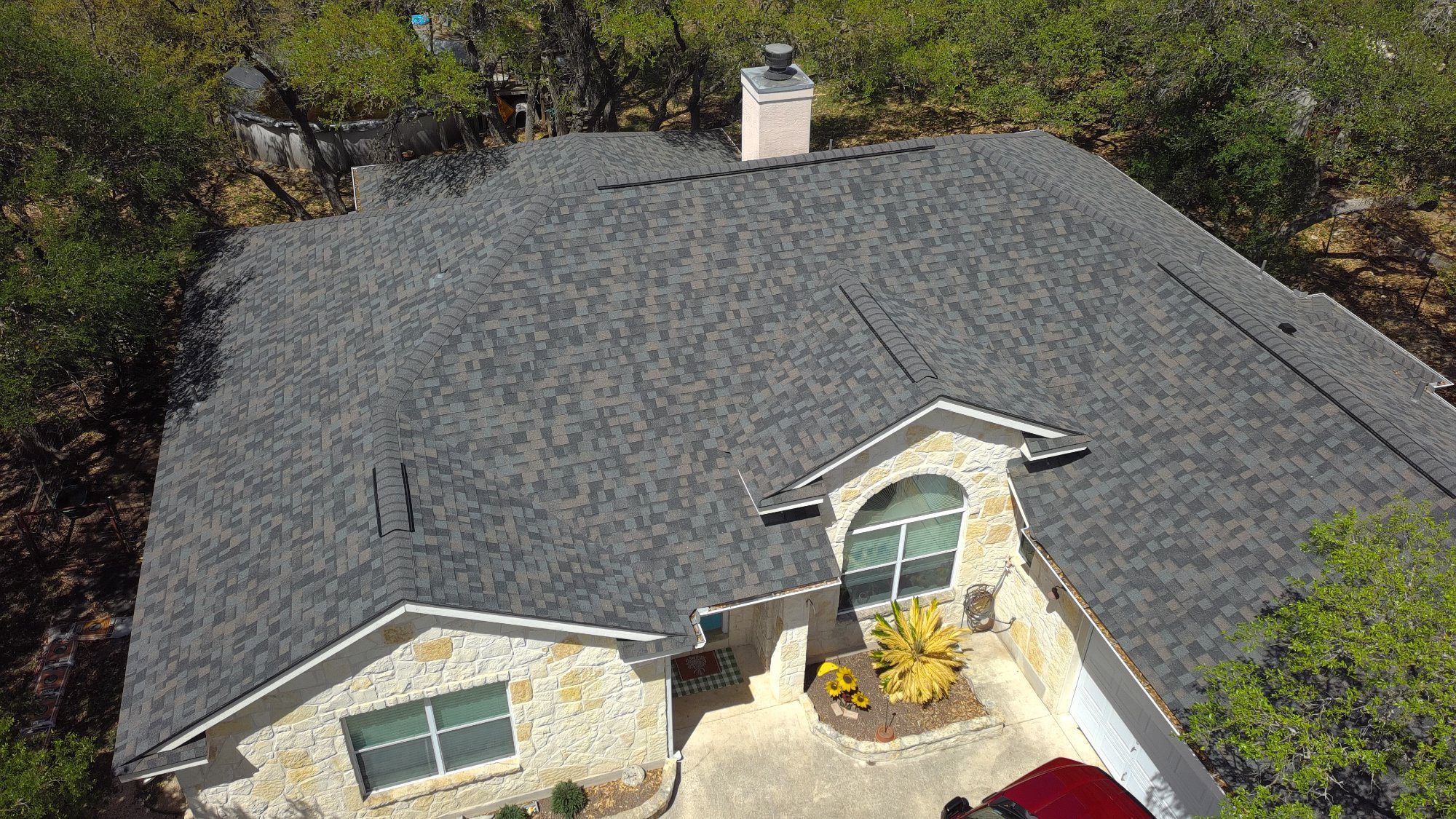 New Zooby roof on a stone home in San Antonio, full roof replacement