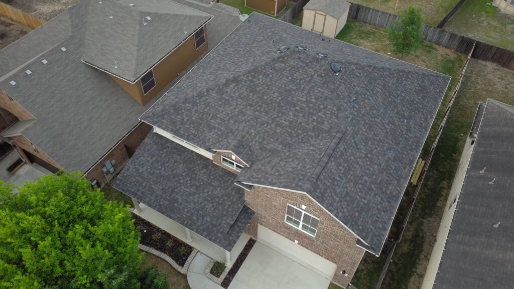 New Zooby shingle roof on a two-story brick home